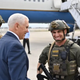 Illustration for article titled Mike Pence Tweets and Later Deletes Photo With Florida Sheriffs Deputy Sporting a QAnon Patch